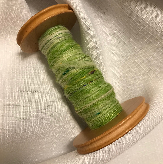 Spring Green singles yarn, on wooden bobbin