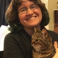 Author photo: Stephanie Burgis (with tortoiseshell cat Pebbles)